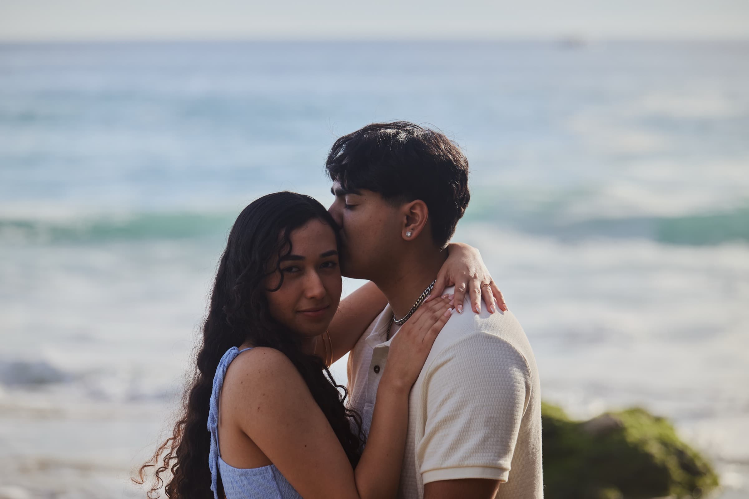 Forehead kiss at the shoreline, Crystal Cove