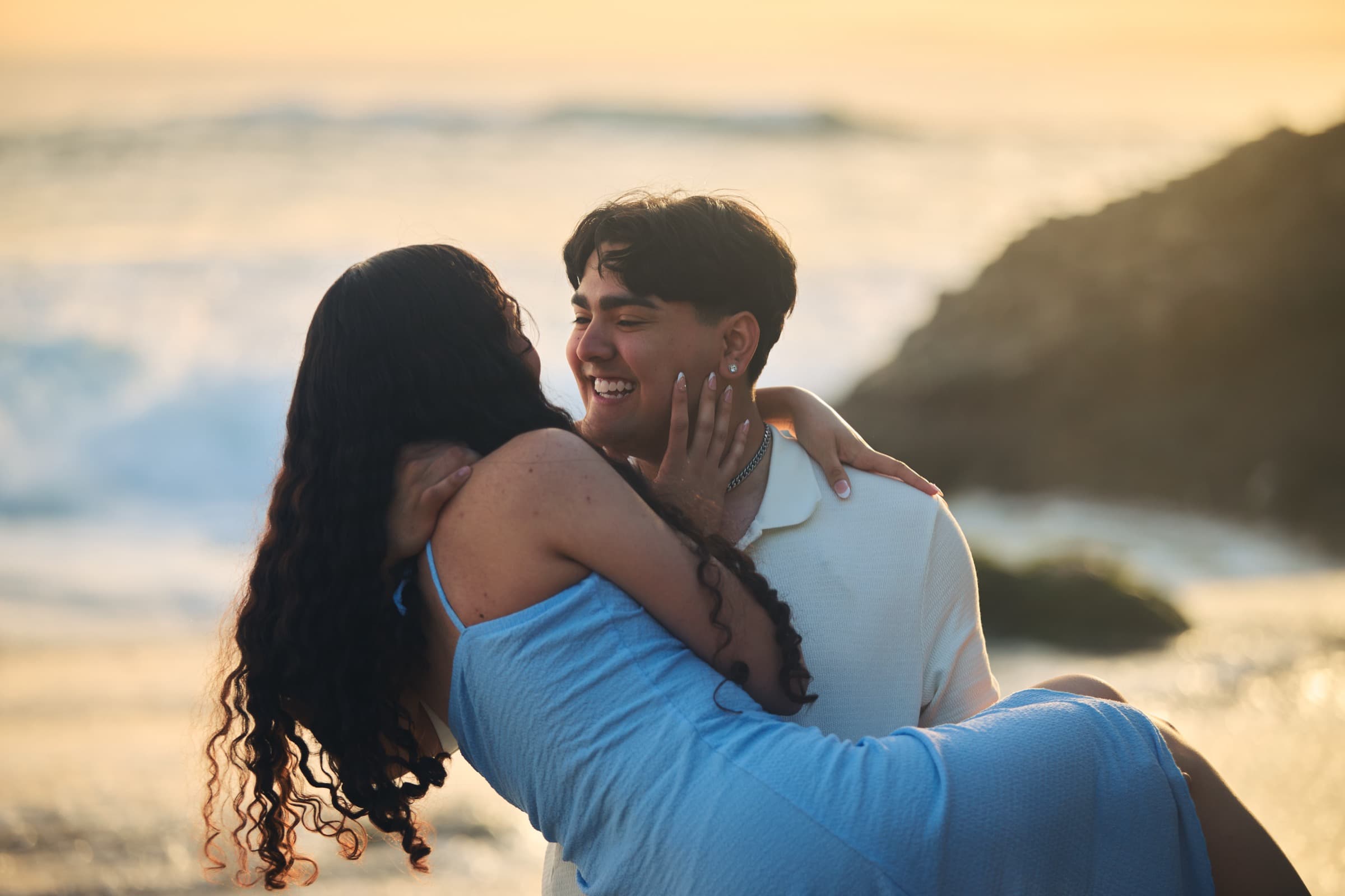Couple laughing, lift at the shoreline
