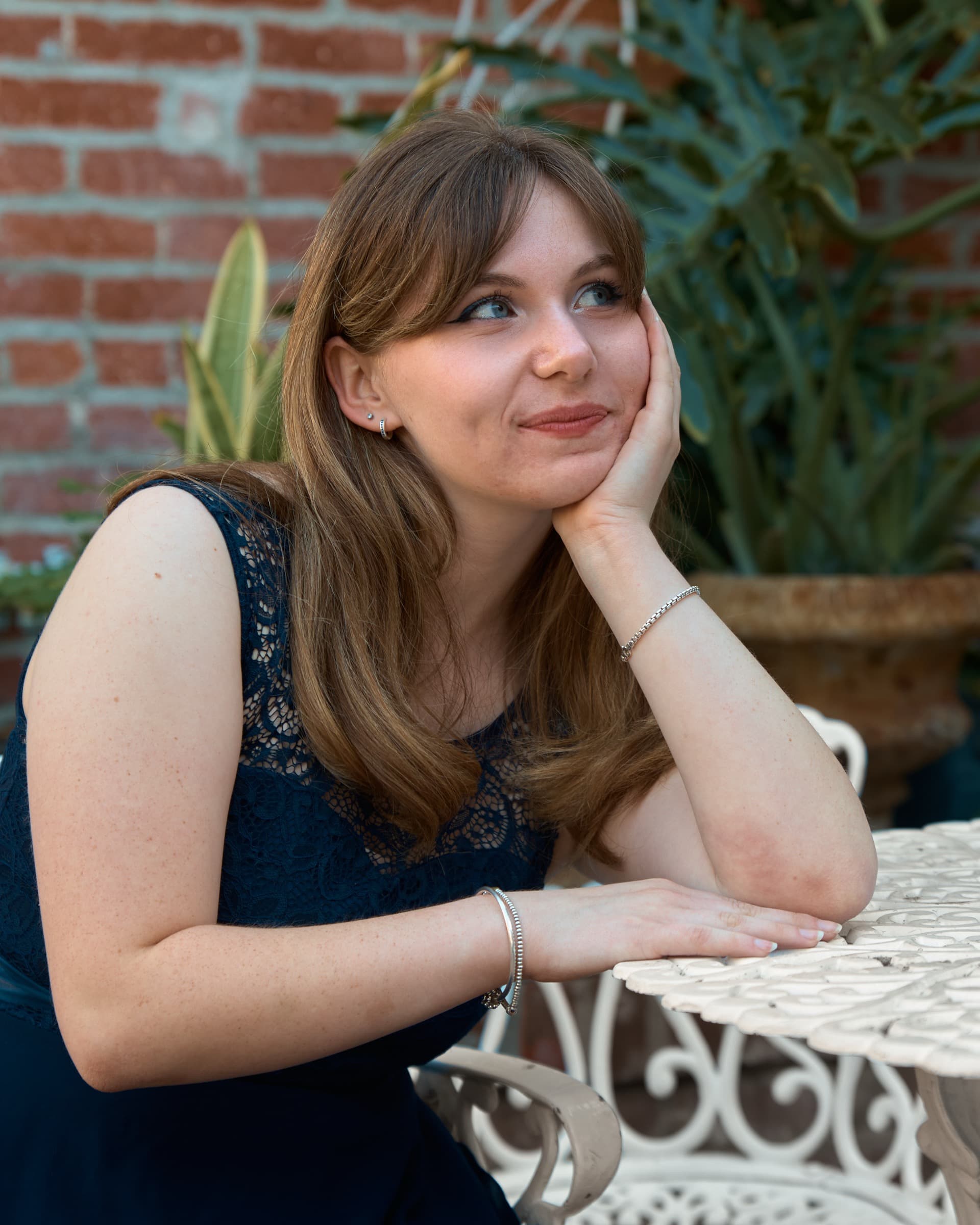 Editorial portrait, navy dress at the café