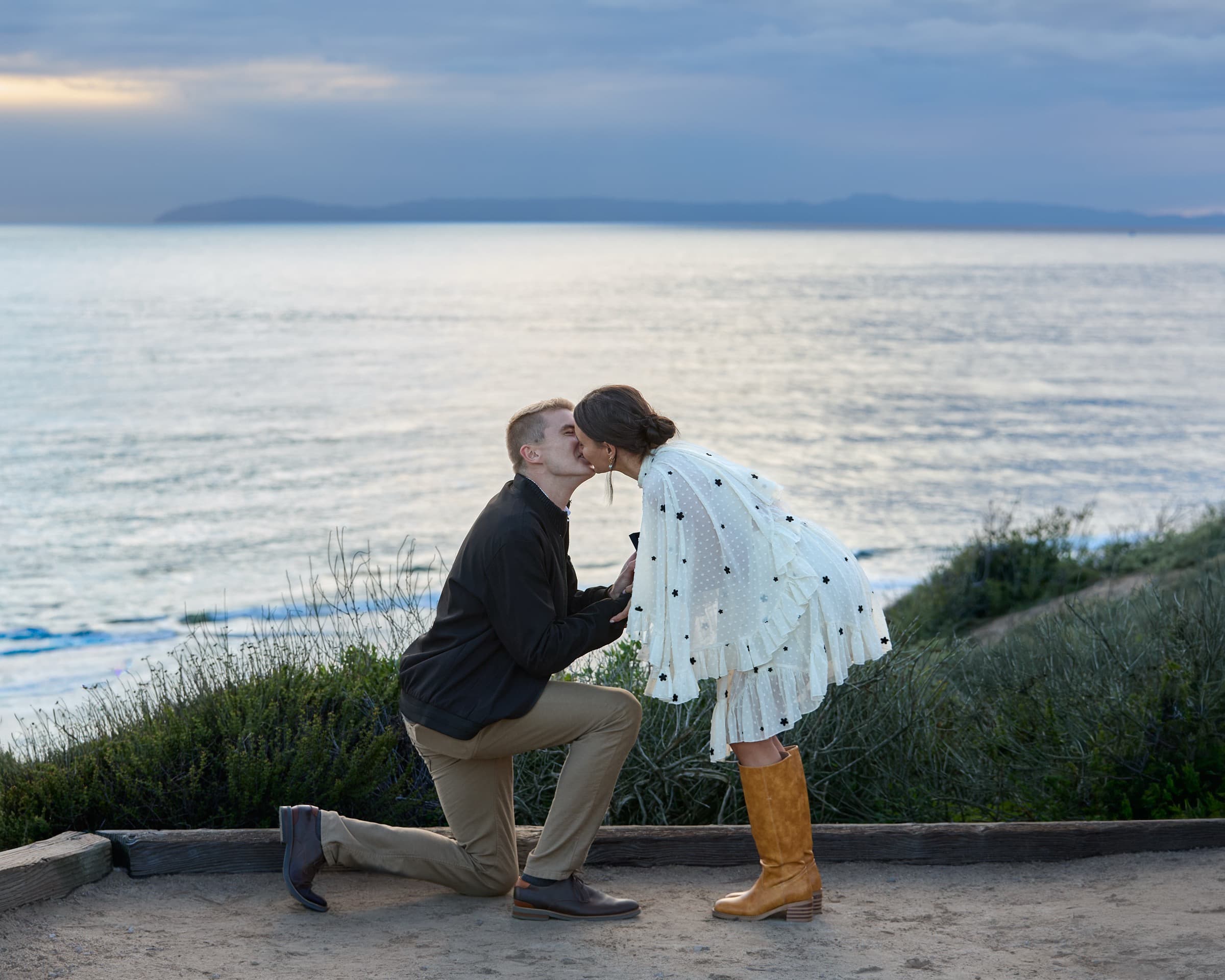 Proposal — kiss after the ring, ocean cliffs